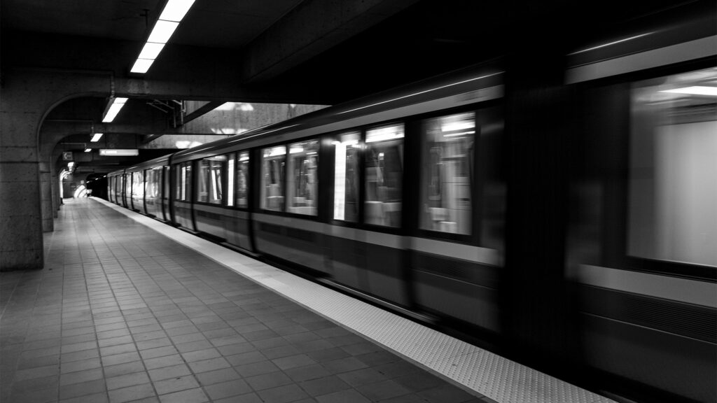 black and white photo of the moving metro of Montreal