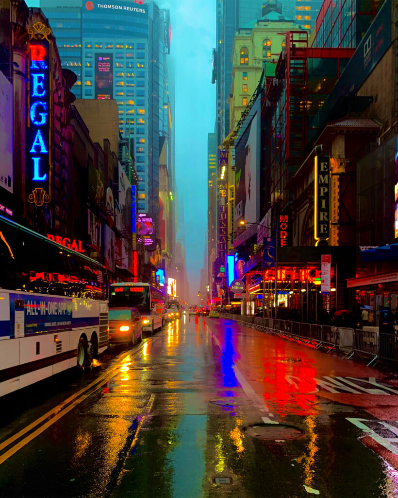 colourful image of Times Square in the rain