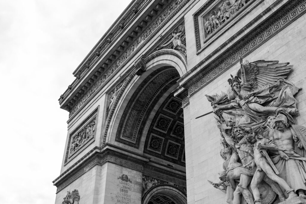 black and white photo of the arc the triomphe close up