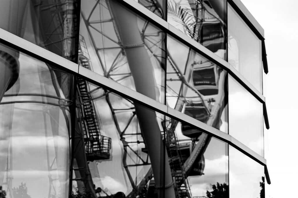 reflection on a window of the Grande Roue of Montreal in black and white