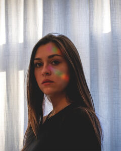 picture of girl face with rainbow on it